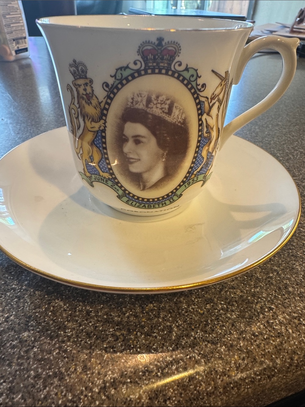 Queen Elizabeth Commemorative White and Gold Porcelain Tea Cup and Saucer